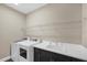 Laundry room with washer, dryer, and utility sink at 12810 Seasong Ter, Bradenton, FL 34211
