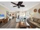Open concept living area with hardwood floors and views of kitchen at 12810 Seasong Ter, Bradenton, FL 34211