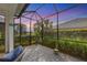 Screened-in patio with a view of the backyard at 12810 Seasong Ter, Bradenton, FL 34211