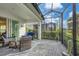 Comfortable screened-in porch with seating at 12810 Seasong Ter, Bradenton, FL 34211