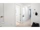 Upstairs hallway with neutral walls and carpeted flooring at 15048 Cuzcorro Ct, Nokomis, FL 34275