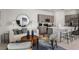 Open concept living room and kitchen with modern furnishings and decor at 15048 Cuzcorro Ct, Nokomis, FL 34275