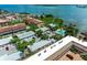 Aerial view showcasing waterfront property and pool at 1603 Gulf N Dr # 24, Bradenton Beach, FL 34217