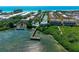 Aerial view of waterfront property with community pool and private dock at 1603 Gulf N Dr # 24, Bradenton Beach, FL 34217