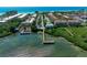 Aerial view of waterfront property with community pool and private dock access at 1603 Gulf N Dr # 24, Bradenton Beach, FL 34217