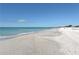 Expansive beach with white sand and clear water at 1603 Gulf N Dr # 24, Bradenton Beach, FL 34217