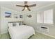Cozy bedroom with a ceiling fan and plenty of natural light at 1603 Gulf N Dr # 24, Bradenton Beach, FL 34217