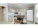 Bright kitchen with ample cabinetry and a breakfast bar at 1603 Gulf N Dr # 24, Bradenton Beach, FL 34217