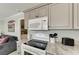 Modern kitchen with granite countertops and updated appliances at 1603 Gulf N Dr # 24, Bradenton Beach, FL 34217