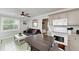 Open living area with comfortable seating and a ceiling fan at 1603 Gulf N Dr # 24, Bradenton Beach, FL 34217