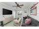 Relaxing living room with a comfortable sofa and flat-screen TV at 1603 Gulf N Dr # 24, Bradenton Beach, FL 34217
