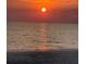 Stunning sunset over the ocean with vibrant colors at 1603 Gulf N Dr # 24, Bradenton Beach, FL 34217