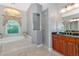 Elegant bathroom featuring a soaking tub and a separate shower at 16806 5Th Ne Ter, Bradenton, FL 34212