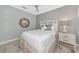 Bright bedroom with a comfy bed, nightstand and light décor at 16806 5Th Ne Ter, Bradenton, FL 34212