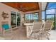Outdoor kitchen with stone countertops and seating area at 16806 5Th Ne Ter, Bradenton, FL 34212