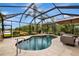 Enclosed pool area with lounge chairs and patio furniture at 16806 5Th Ne Ter, Bradenton, FL 34212