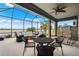 Relaxing screened porch overlooking a lake, perfect for outdoor enjoyment at 184 Maraviya Blvd, Nokomis, FL 34275