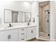 Elegant bathroom with double vanity, and a glass-enclosed shower at 1906 Harbour Links Cir # 14, Longboat Key, FL 34228