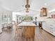 Open concept kitchen with large island and hardwood floors at 1906 Harbour Links Cir # 14, Longboat Key, FL 34228