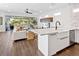 Open concept kitchen with island and stainless steel appliances at 1906 Harbour Links Cir # 14, Longboat Key, FL 34228