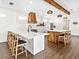 Modern kitchen with a large island and double sink at 1906 Harbour Links Cir # 14, Longboat Key, FL 34228