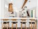 Modern kitchen with breakfast bar and wood accents at 1906 Harbour Links Cir # 14, Longboat Key, FL 34228
