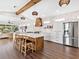 Modern kitchen with large island and wood accents at 1906 Harbour Links Cir # 14, Longboat Key, FL 34228