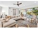 L shaped sectional sofa and sliding glass doors to the patio at 1906 Harbour Links Cir # 14, Longboat Key, FL 34228