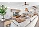 Spacious living room with a modern sectional sofa and wood flooring at 1906 Harbour Links Cir # 14, Longboat Key, FL 34228