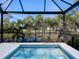 Relaxing screened-in pool with water views at 1906 Harbour Links Cir # 14, Longboat Key, FL 34228
