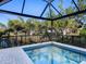 Relaxing screened-in pool with water views at 1906 Harbour Links Cir # 14, Longboat Key, FL 34228