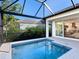 Inviting screened pool and patio with modern design at 1906 Harbour Links Cir # 14, Longboat Key, FL 34228