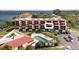 Aerial view of condo building showcasing a unit and pool at 204 3Rd W St # 203, Bradenton, FL 34205
