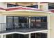 Relax on this condo's balcony, featuring comfortable seating at 204 3Rd W St # 203, Bradenton, FL 34205