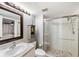 Bright bathroom with walk-in shower and updated vanity at 204 3Rd W St # 203, Bradenton, FL 34205