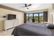 King-size bed, balcony access and city view at 204 3Rd W St # 203, Bradenton, FL 34205