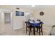 Small dining area with a dark wood table and blue tablecloth at 204 3Rd W St # 203, Bradenton, FL 34205