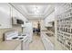 Bright kitchen features white cabinets, stainless steel appliances, and a tile backsplash at 204 3Rd W St # 203, Bradenton, FL 34205