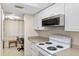 Clean and efficient kitchen with white appliances and cabinets at 204 3Rd W St # 203, Bradenton, FL 34205