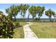 Paved walkway through a grassy area towards a bridge at 204 3Rd W St # 203, Bradenton, FL 34205