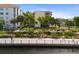 Waterfront walkway with people enjoying the view and nearby buildings at 204 3Rd W St # 203, Bradenton, FL 34205