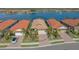 Community view showcasing a home near a lake at 204 Villoresi Blvd, Nokomis, FL 34275