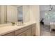 Modern bathroom with updated vanity and a view of bedroom at 204 Villoresi Blvd, Nokomis, FL 34275