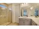 Elegant bathroom featuring a walk-in shower and dual sinks at 204 Villoresi Blvd, Nokomis, FL 34275