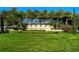 Toscana Isles community entrance with lush landscaping and palm trees at 204 Villoresi Blvd, Nokomis, FL 34275