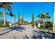 Landscaped entryway to the community with palm trees at 204 Villoresi Blvd, Nokomis, FL 34275