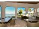 Waterfront patio with seating and stunning lake views at 204 Villoresi Blvd, Nokomis, FL 34275