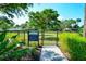 Fenced-in dog park with grassy area and walking path at 204 Villoresi Blvd, Nokomis, FL 34275