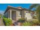 One-story home with a two-car garage and landscaped front yard at 204 Villoresi Blvd, Nokomis, FL 34275