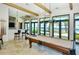 Clubhouse game room with pool table and bar area at 204 Villoresi Blvd, Nokomis, FL 34275
